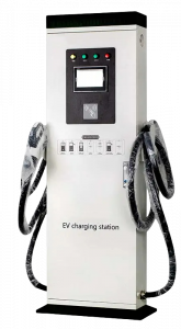 The image features a DC electric vehicle (EV) charging station, designed for fast charging of electric cars. The station is equipped with dual charging cables, allowing simultaneous charging of two vehicles. It includes an interface with status indicators and a screen for user interaction, facilitating an efficient and user-friendly charging experience. The station's design is robust and sleek, suitable for public or private parking areas.